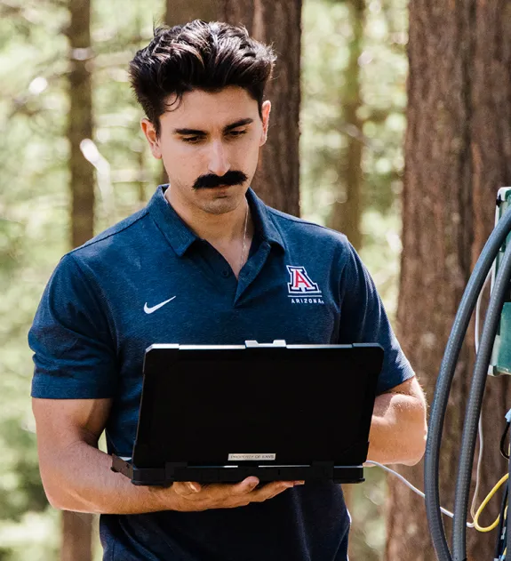 A graduate student works in the Critical Research area in the Santa Catalina Mountains near Tucson